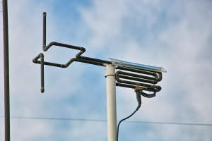 A photograph of the cycloid dipole installed atop the peak of the roof.